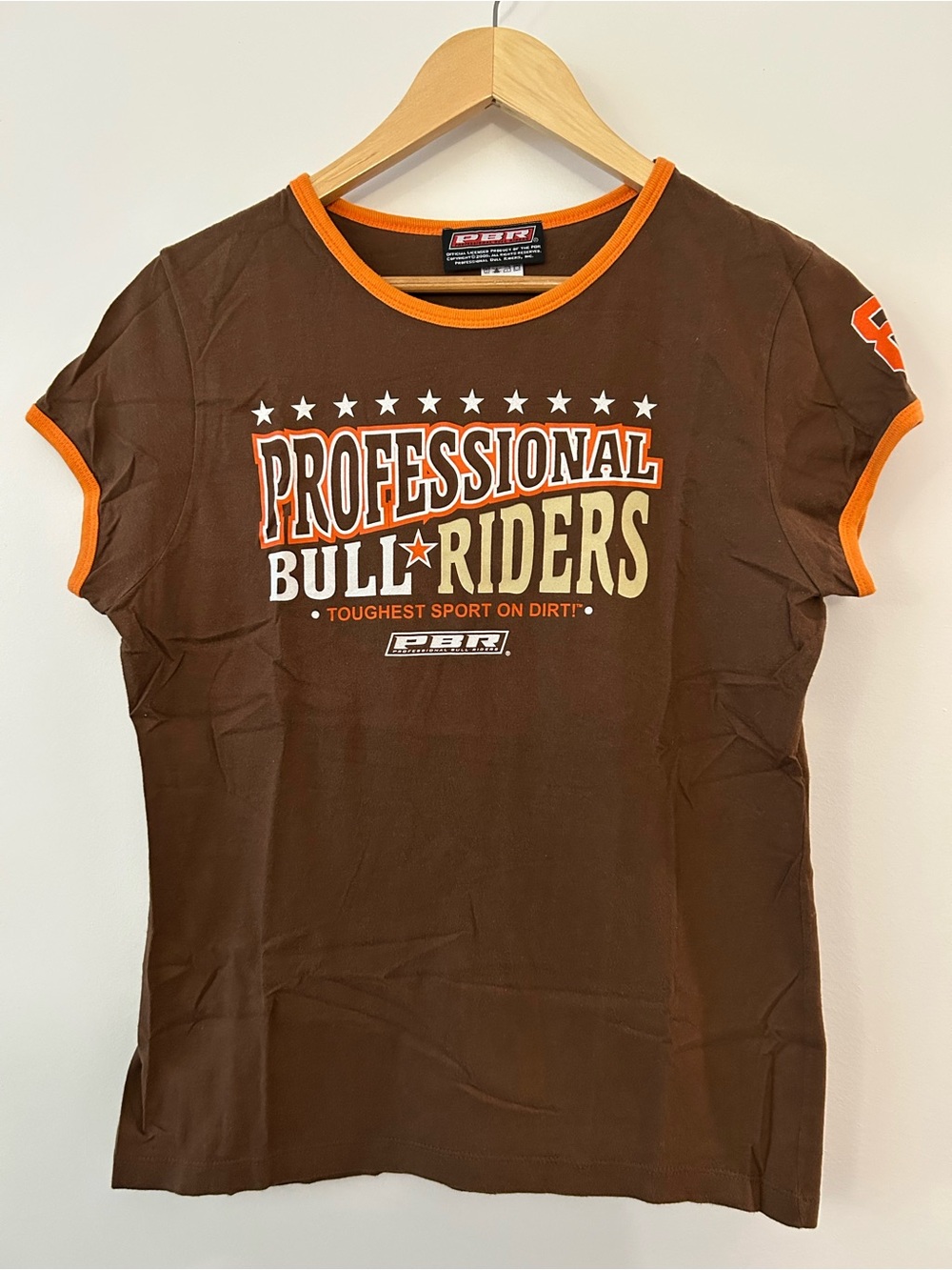 Professional Bull Riders 2005 PBR Brown Graphic Souvenir Tee with Orange Trim.